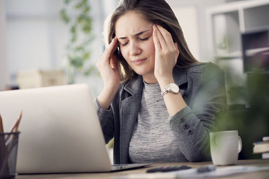 Working woman have a headache