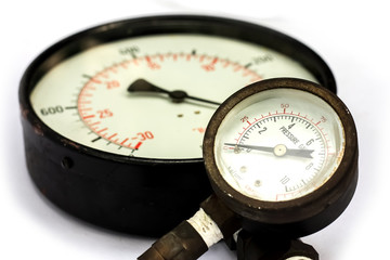 Close up old and rusty pressure gauge isorated on white Background