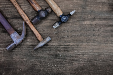 Hammer craftsman tool on wooden table, vintage  style