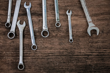 Wrench craftsman tool on wooden table, vintage  style