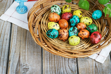 Easter background with Easter eggs in the basket and spring flowers