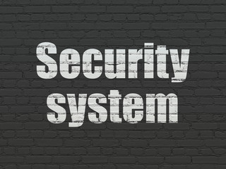 Safety concept: Painted white text Security System on Black Brick wall background
