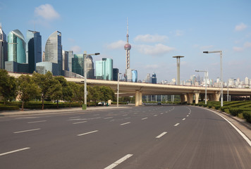 Empty road surface floor with city landmark buildings of Shanghai Skyline