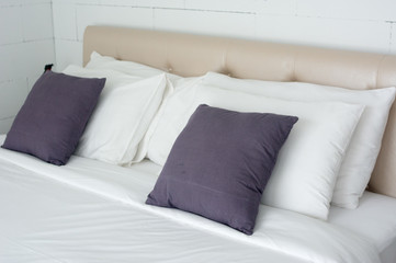 comfortable pillow on bed decoration in bedroom interior at luxury Hotel.