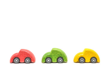 Isolated Colorful wooden car toys in row sequence on white background