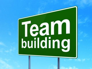 Finance concept: Team Building on green road highway sign, clear blue sky background, 3D rendering