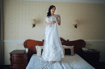 The beautiful bride in the morning dresses for a wedding ceremon