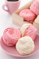Homemade zephyr or marshmallow with coffee on pink background