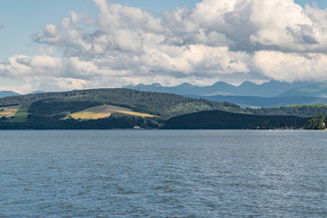 Orava reservoir with mountains in the background