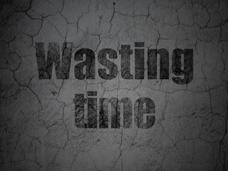 Timeline concept: Black Wasting Time on grunge textured concrete wall background
