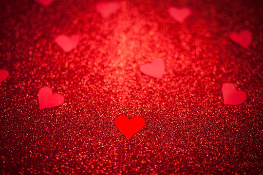 red shiny background with red little hearts, love, Valentine's Day, texture abstract background, suitable for ads,