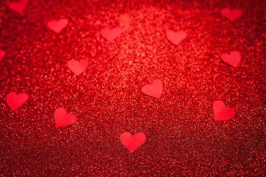 red shiny background with red little hearts, love, Valentine's Day, texture abstract background, suitable for ads,