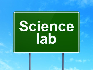Science concept: Science Lab on green road highway sign, clear blue sky background, 3D rendering