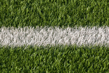 White stripe of astroturf American football field