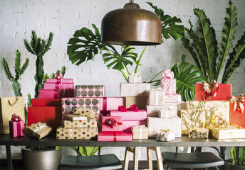 Stacks of colorful gift boxes on a table.