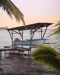Boat in Tahiti by sunset