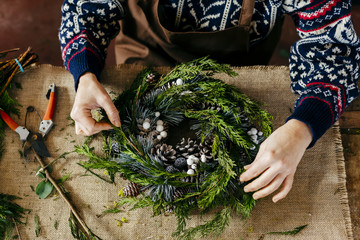 Woman making Christmas wreath