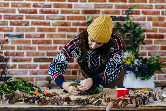Woman making floral composition