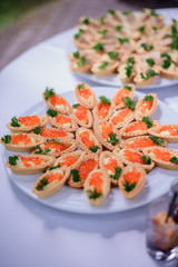 Basckets with red caviar served on white plates