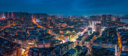 High angle view of city illuminated at night