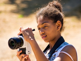 young girl takes a picture
