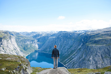 Man on Stone at Lake