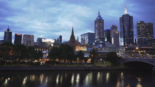 pan at night of the yarra river and melbourne center in the australian state of victoria