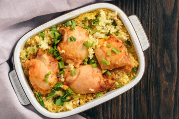 Oven baked chicken meat with rice.
