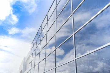 Fototapeta na wymiar Reflection of the sky in buildings glass.