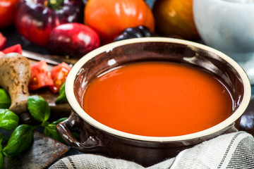 Rustic pot with creamy tomato soup