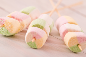 Marshmallows on wooden table. 