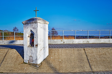 landscape viev of a lonely Catholic chapel in the late afternoon on the boardwalk
