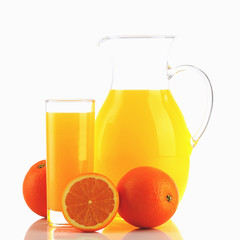 Fresh orange juice and oranges isolated on white