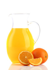 Jug of orange juice and oranges isolated on white