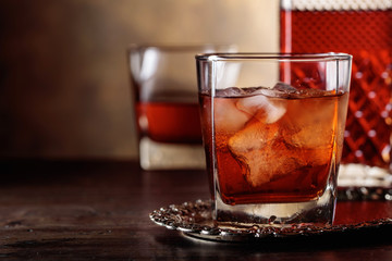 Glass of scotch whiskey and natural ice .