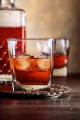 Glass of scotch whiskey and natural ice .