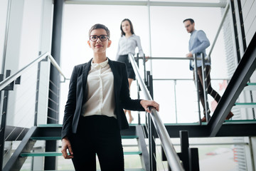 Portrait of young beautiful businesswoman with glasses