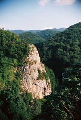 Landscape view over the forest, rocks and hills
