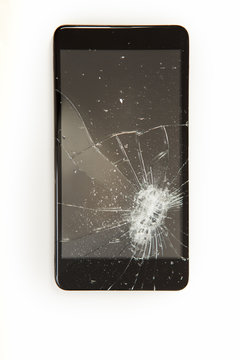 Close-up of a smartphone with broken display