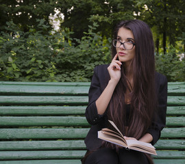 girl with a book in the park