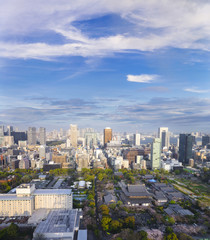 Landscape of tokyo city skyline in Aerial view with skyscraper, modern office building and blue sky with cloudy sky background in Tokyo metropolis, Japan.