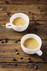 Hot strong coffee on the wooden table