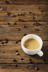 Hot strong coffee on the wooden table