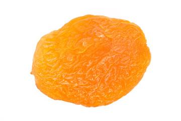 Dried apricot ingredient close up isolated on a white background. One orange apricot fruit with clipping path photo for advertising