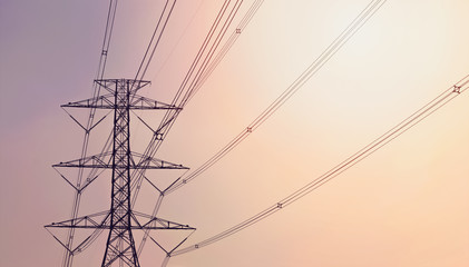 electricity pylon against the violet and orange background