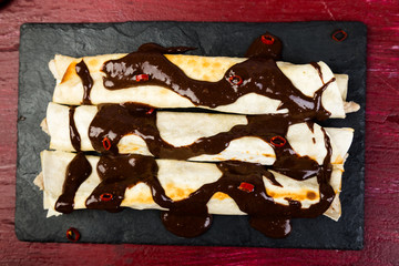 Mexican chicken enchiladas with chili chocolate salsa