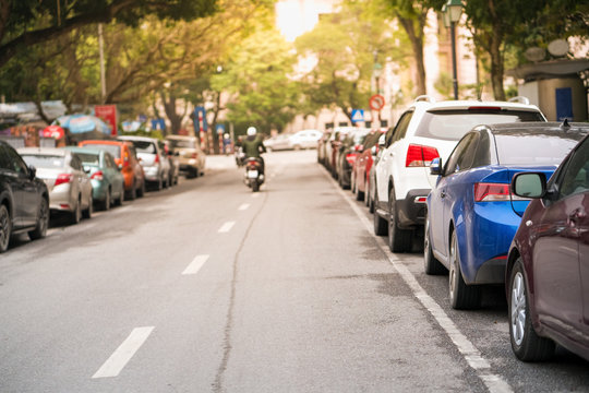 Cars parked on the urban street side