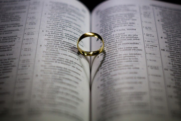 Fototapeta premium Heart-shaped shadow on Bible