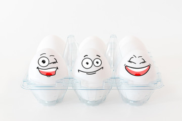White eggs with funny faces.