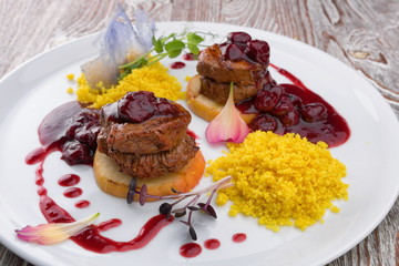 Meat medallions with sauce